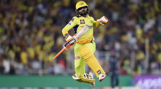 Ravindra Jadeja punches the air in delight.