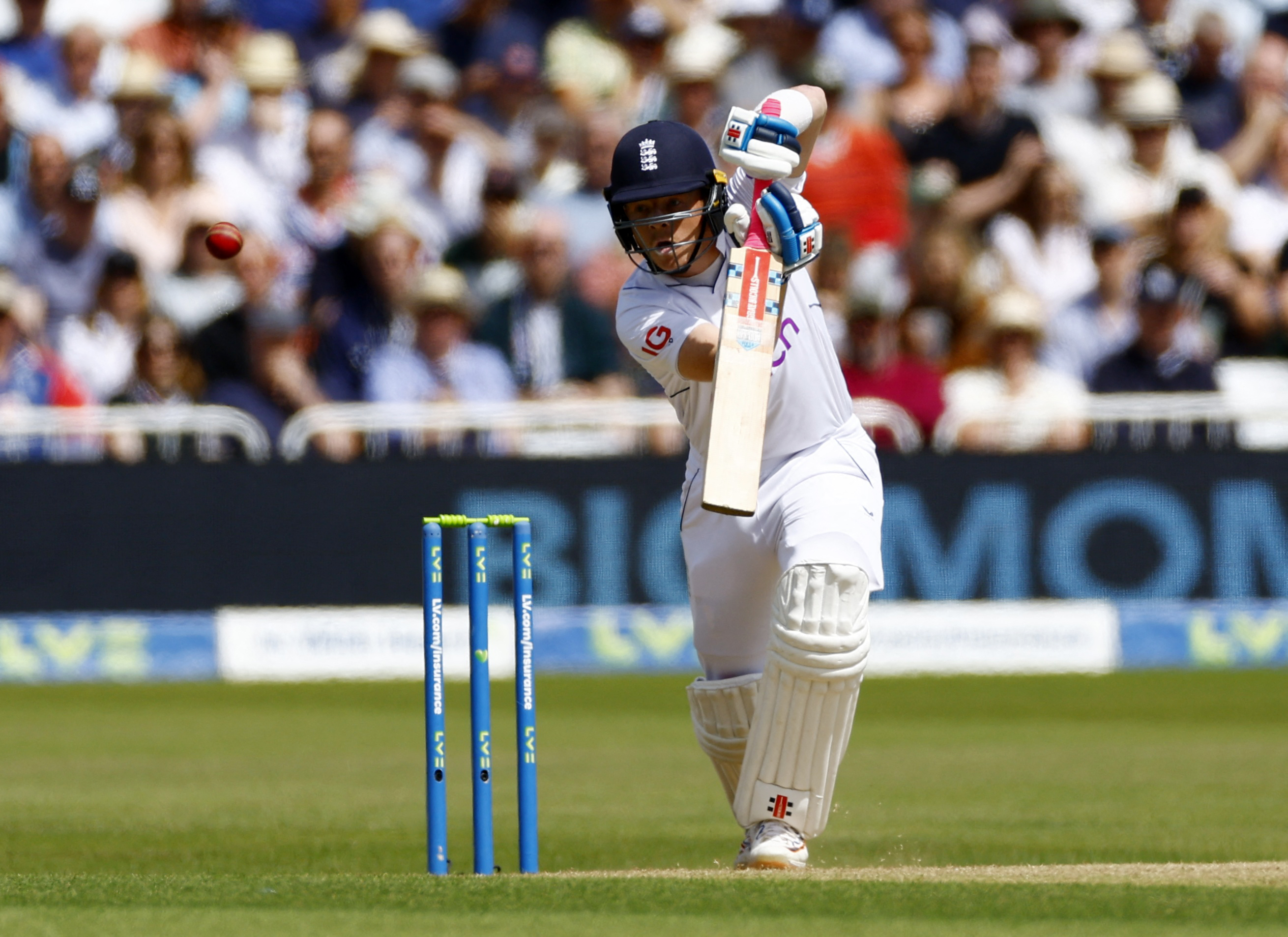 Ollie Pope shimmies down to crack an imperious on-drive